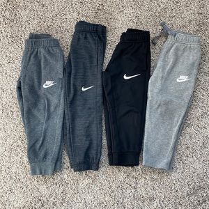 4 pairs of Nike pants